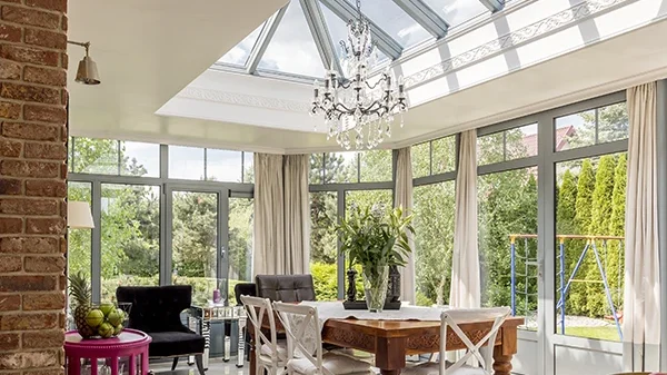 Bright conservatory with roof lantern by Wombourne Windows